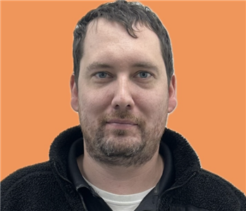 man in front of orange background