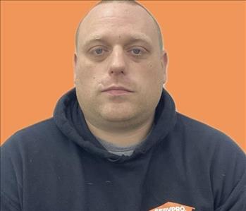 man in front of orange background