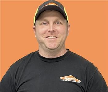 man in front of orange background