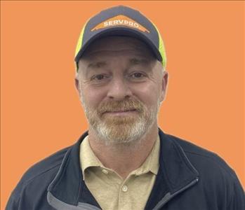 man in front of orange background