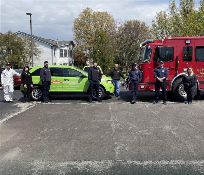 SERVPRO car and a fire truck.
