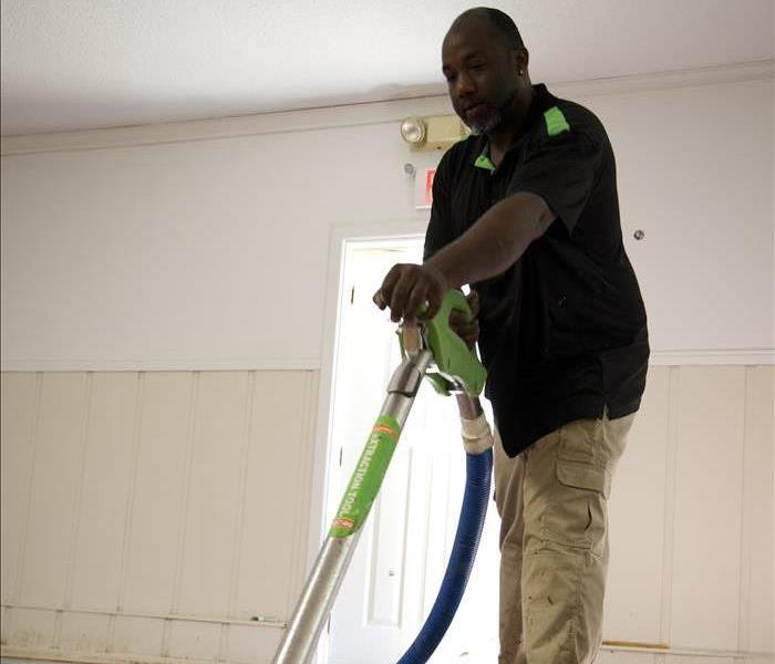 A SERVPRO technician working on assessing damage. 