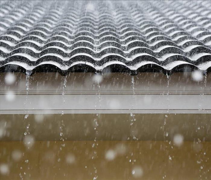 Heavy rainfall on a roof.